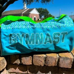 Duffel bag with “GYMNASTS” on the front